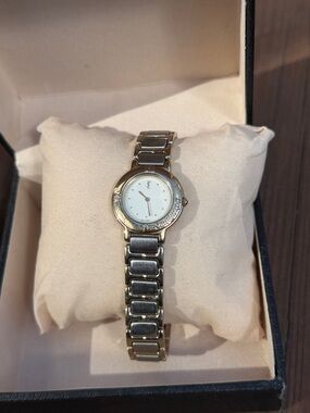 Yves Saint Laurent Women’s Silver Bracelet Watch with White Dial